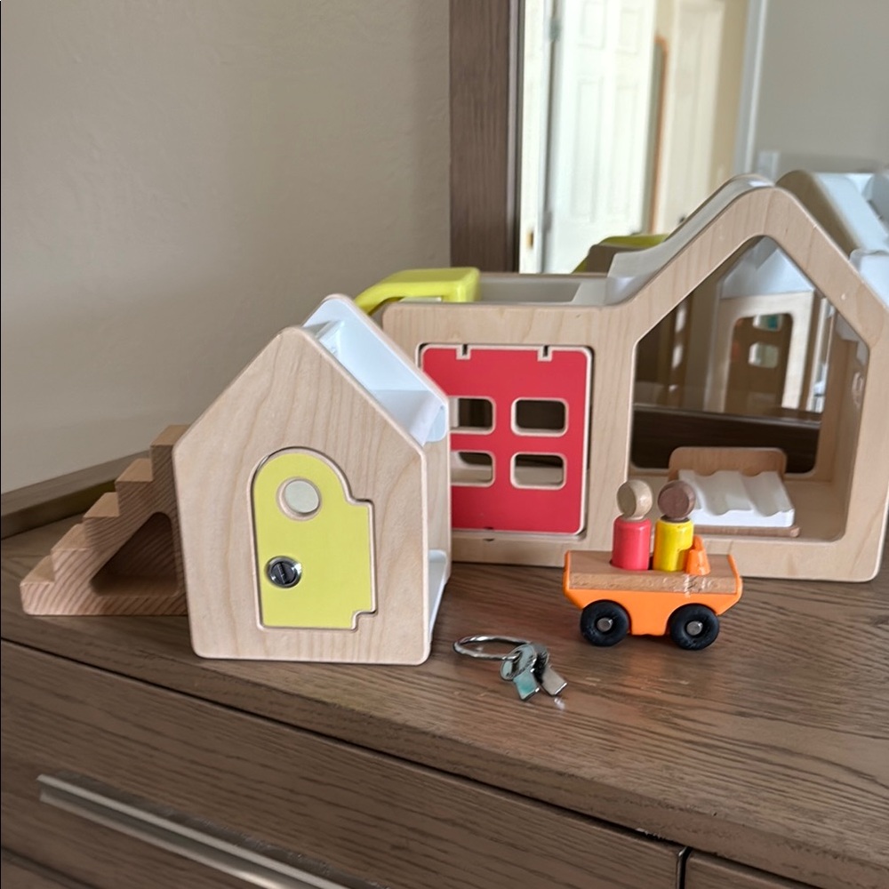 Lovevery modular playhouse with wooden accessories and two seat speedster